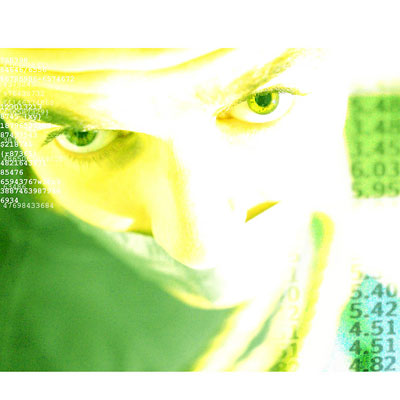Photo of a man's face looking towards you with numbers in the background representing the data he seeks.
